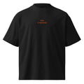 Non ti riguarda — t-shirt oversize nera, ricamo arancione
