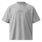 Non ti riguarda — t-shirt oversize grigia, ricamo arancione