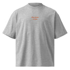 Non torno a casa — t-shirt oversize grigia, ricamo arancione